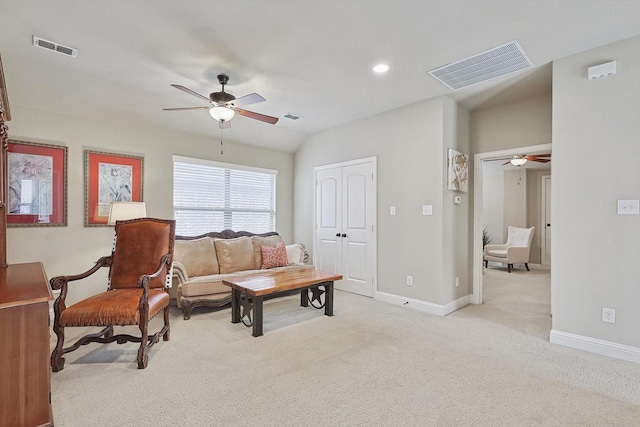 living area featuring carpet, visible vents, and baseboards