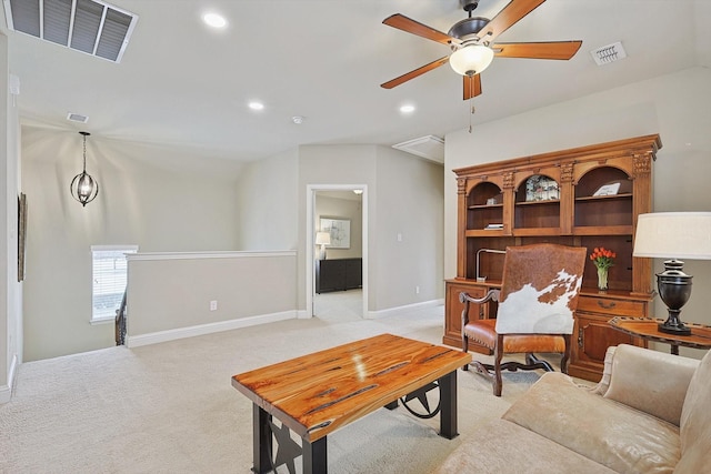 living area with light carpet, visible vents, and recessed lighting