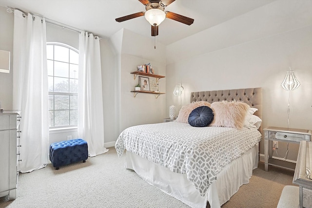 bedroom featuring a ceiling fan, carpet, and baseboards