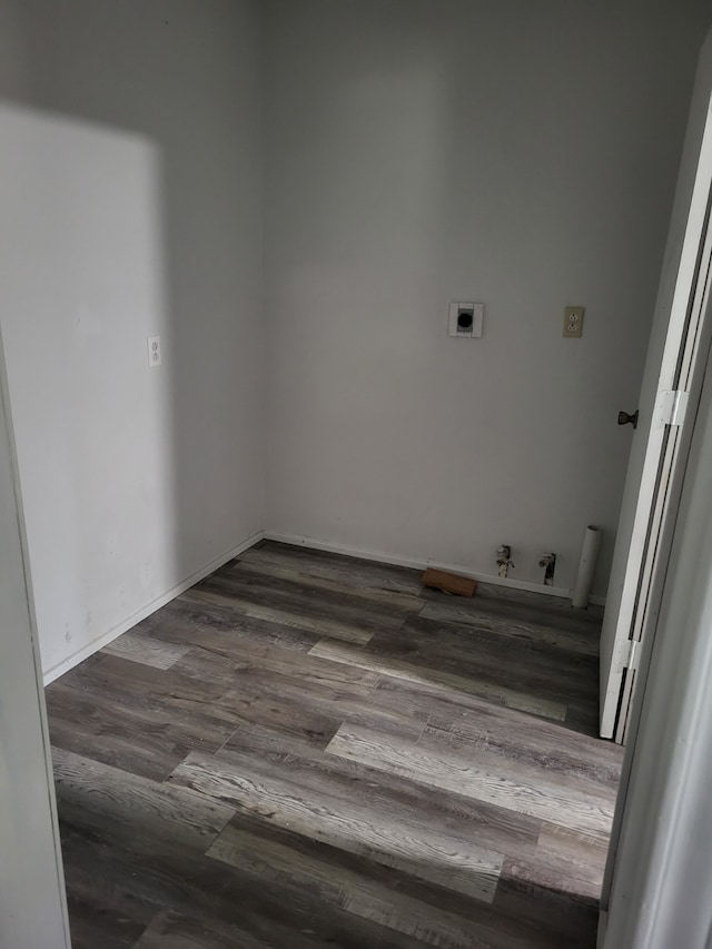 laundry area featuring hookup for an electric dryer, laundry area, washer hookup, baseboards, and dark wood finished floors