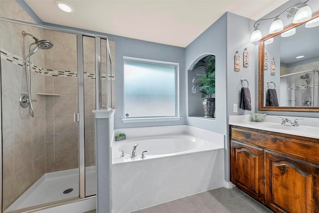 full bath with a garden tub, tile patterned flooring, vanity, and a shower stall