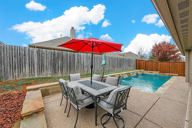 view of pool featuring outdoor dining area, a patio area, a fenced backyard, and a fenced in pool