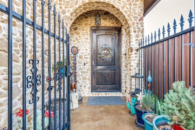 doorway to property featuring stone siding