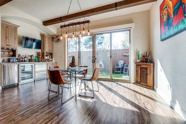 dining room with wine cooler, dark wood-type flooring, baseboards, a bar, and beamed ceiling