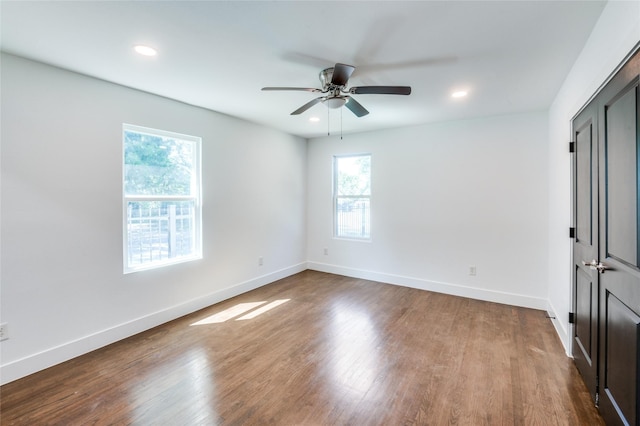 unfurnished room featuring ceiling fan, baseboards, wood finished floors, and recessed lighting