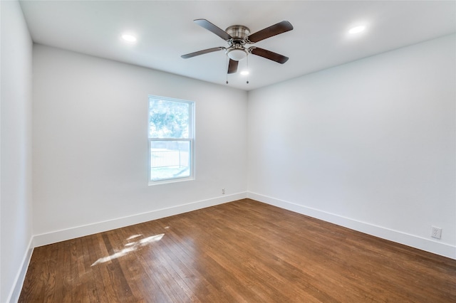 empty room featuring a ceiling fan, baseboards, wood finished floors, and recessed lighting