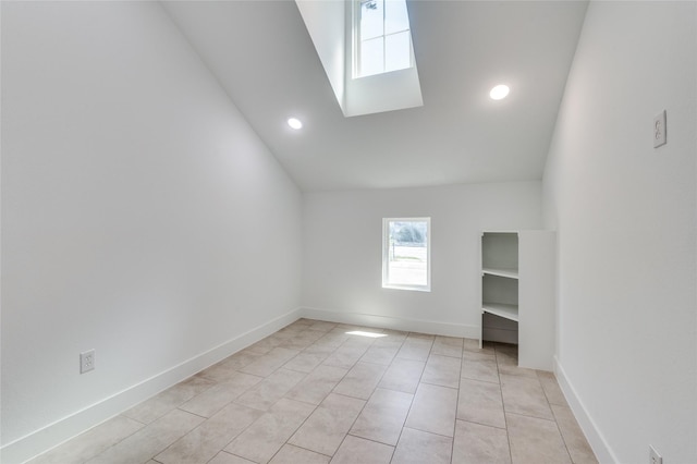 interior space featuring recessed lighting, baseboards, and light tile patterned floors