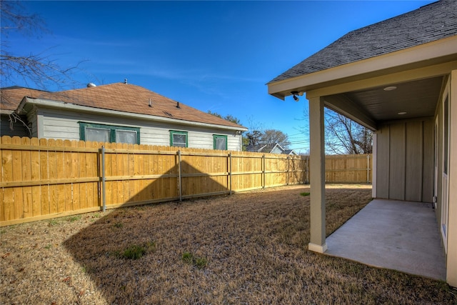 view of yard with a patio area and a fenced backyard