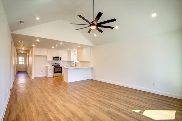 unfurnished living room with visible vents, baseboards, ceiling fan, light wood-style floors, and high vaulted ceiling