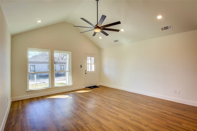 spare room with a ceiling fan, baseboards, visible vents, and wood finished floors