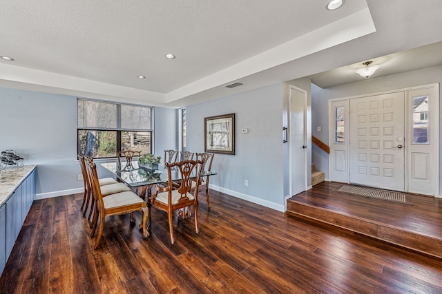 dining space featuring a healthy amount of sunlight, dark wood-style floors, baseboards, and recessed lighting