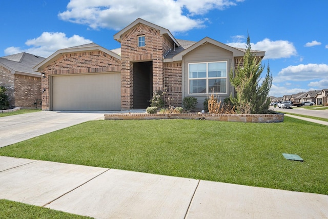 view of front facade with a front yard, brick siding, driveway, and an attached garage