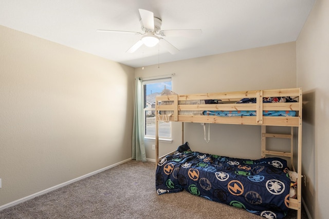 carpeted bedroom featuring ceiling fan and baseboards