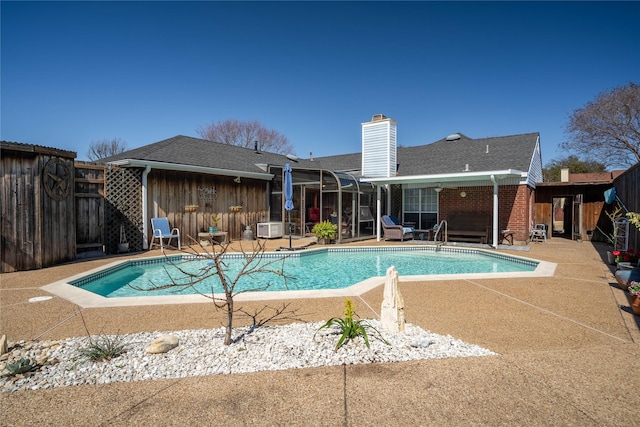 view of pool with a fenced backyard, a fenced in pool, and a patio