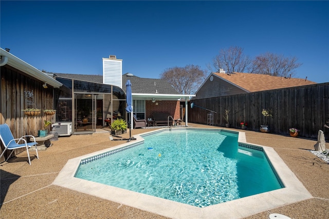 view of pool featuring a patio area, a fenced backyard, and a fenced in pool