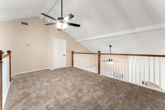 unfurnished room with vaulted ceiling with beams, ceiling fan, carpet flooring, and visible vents