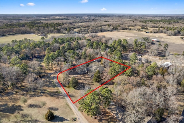 birds eye view of property featuring a rural view