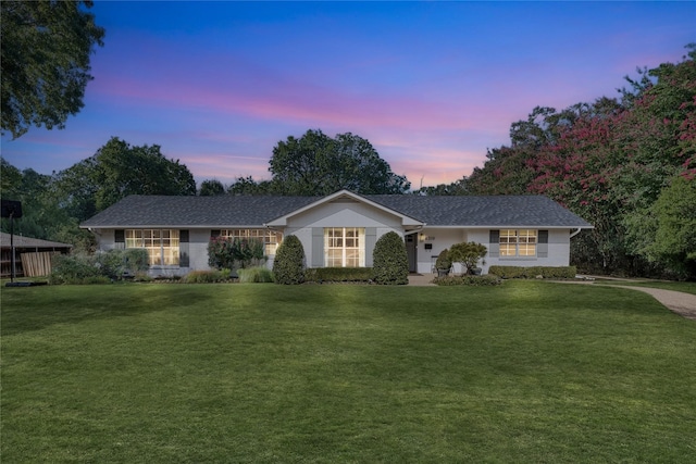 single story home with a front lawn