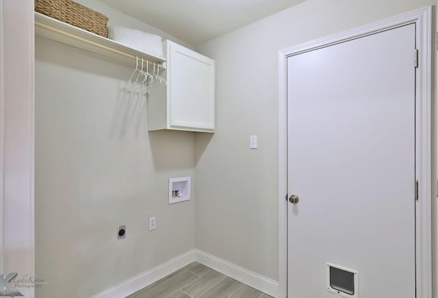 laundry room with washer hookup, cabinet space, light wood-style flooring, electric dryer hookup, and baseboards