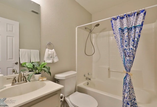 bathroom with shower / bath combo, visible vents, vanity, and toilet