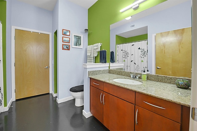 bathroom with toilet, baseboards, visible vents, and vanity