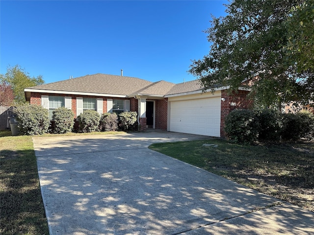 single story home with a garage, concrete driveway, brick siding, and a shingled roof