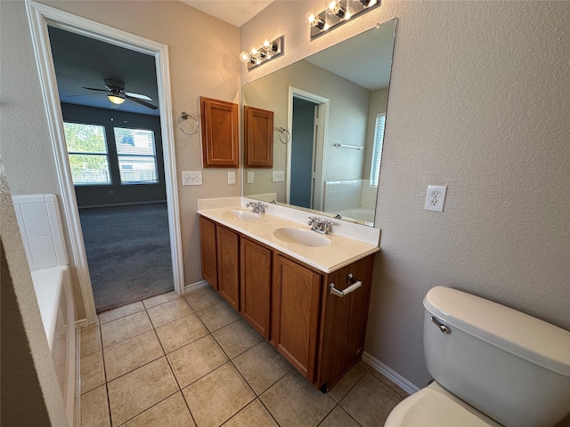 full bath featuring ceiling fan, tile patterned flooring, a sink, and toilet