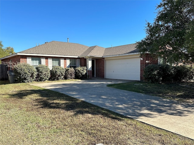 ranch-style house featuring a garage, driveway, a shingled roof, brick siding, and a front yard