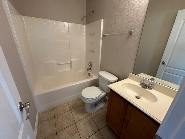 full bath featuring toilet, tile patterned floors, tub / shower combination, and a textured wall