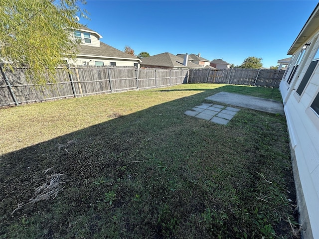 view of yard featuring a fenced backyard