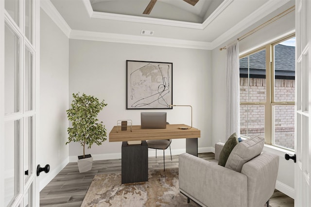 office featuring baseboards, a wealth of natural light, and wood finished floors