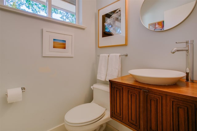 bathroom with toilet and vanity