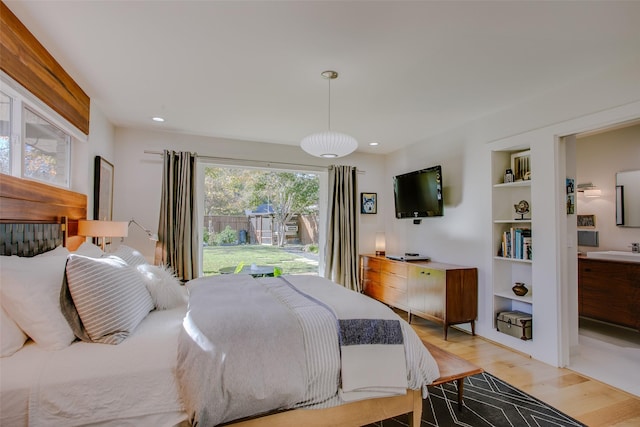 bedroom featuring light wood-type flooring and recessed lighting