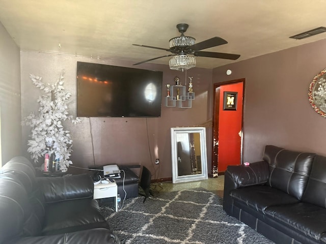 living area featuring visible vents and ceiling fan