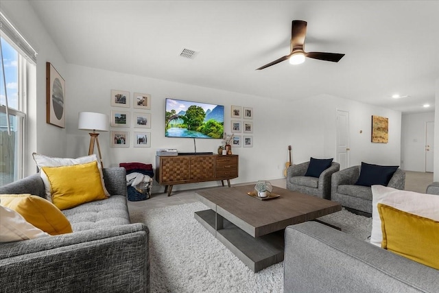 living room featuring ceiling fan, visible vents, and recessed lighting