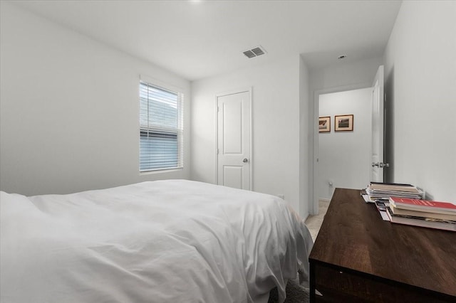 bedroom featuring carpet and visible vents