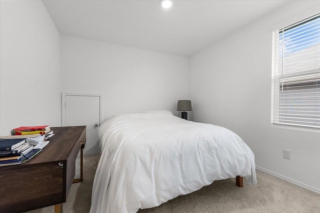 bedroom featuring light colored carpet