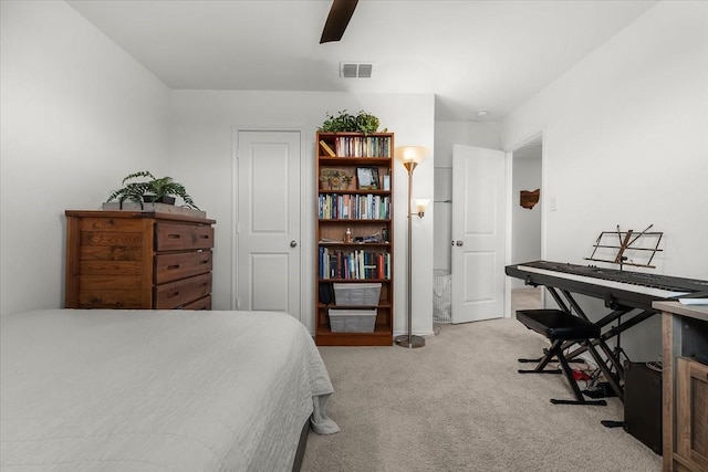 bedroom featuring light carpet, ceiling fan, and visible vents