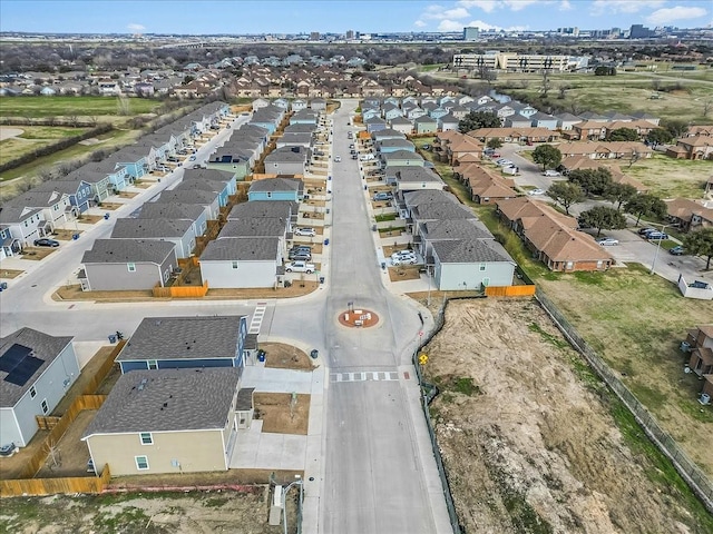 birds eye view of property with a residential view