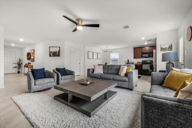 living area with recessed lighting, visible vents, and ceiling fan with notable chandelier