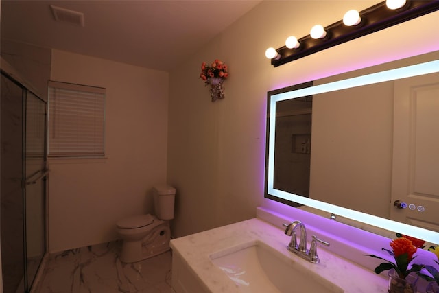 bathroom with toilet, visible vents, vanity, marble finish floor, and a stall shower