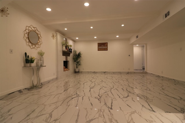 empty room with recessed lighting, visible vents, baseboards, marble finish floor, and beam ceiling