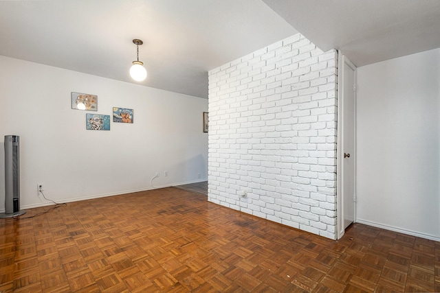 unfurnished room featuring baseboards