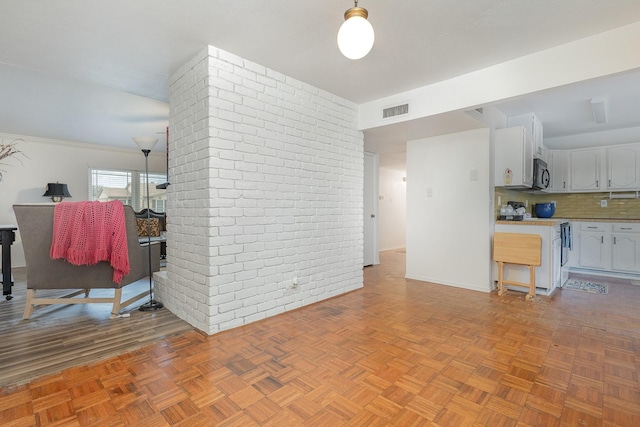 living area featuring visible vents