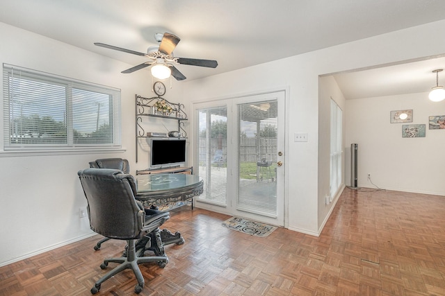 office area featuring ceiling fan and baseboards