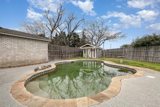 view of swimming pool featuring a patio, a fenced backyard, a storage shed, an outdoor structure, and a fenced in pool