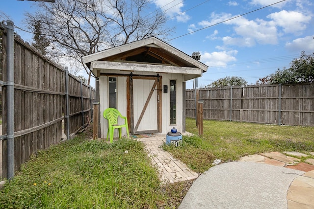 view of shed featuring a fenced backyard