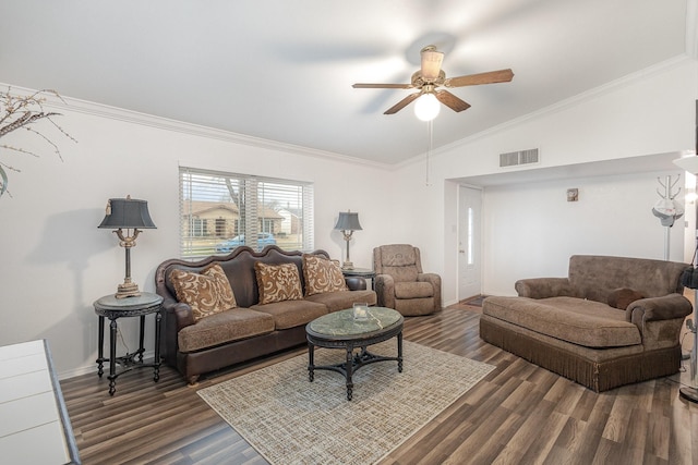 living area featuring dark wood-style floors, visible vents, vaulted ceiling, and ornamental molding