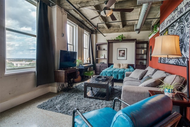 interior space featuring a ceiling fan and a healthy amount of sunlight