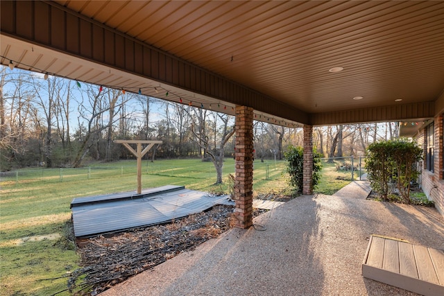 view of patio featuring fence